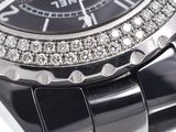 a close up of a watch with diamonds on it