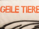 a graffiti on the wall of a building that says gelle tiere