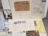 an open suitcase filled with lots of old postcards sitting on top of a table