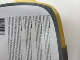 a close up of the back of a yellow and black case