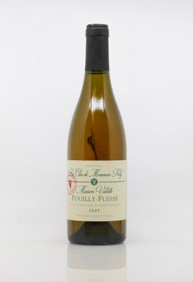a bottle of wine that is sitting on a table