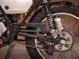 a close up of a motorcycle with a chain attached to it