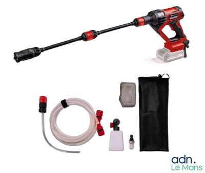 a close up of a corded blower with a hose and a bag