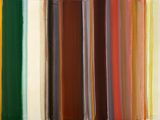 a lot of different colored pencils in a row