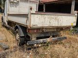 a white truck that is parked in the grass