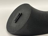 a black object that is on a white surface