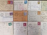 many different types of letters and envelopes on the table