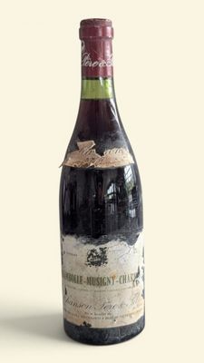 a bottle of wine that is sitting on a table