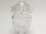 clear glass jar with a lid on a white surface
