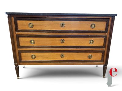 an image of a wooden chest of drawers with a marble top