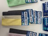 a lot of cleaning cloths on a white table