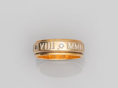 a gold ring with roman numerals on it