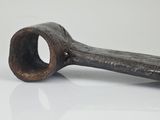 an old pipe that is sitting on a white surface