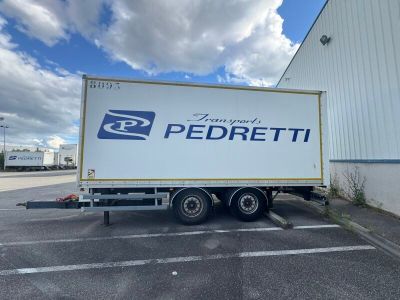 the truck is parked in the parking lot outside of the building