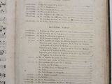 an old book with a page of music written in it