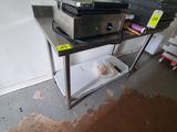 a microwave sitting on top of a shelf in a room