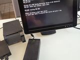 a laptop computer sitting on top of a white desk