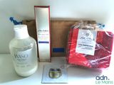 a bottle of lotion, a bag of soap, and a bottle of lotion sitting on a table