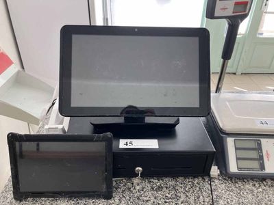 a picture of a cash register machine with a tablet on it