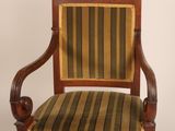 an image of a chair with a striped upholstered seat