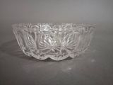 a glass bowl that is sitting on a table