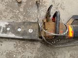 a chainsaw that is laying on the ground