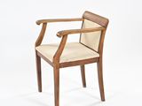 an image of a wooden chair with a beige upholstered seat