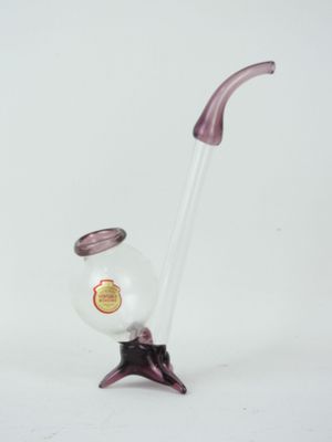 purple glass vase with a curved handle and a clear glass vase with a red handle
