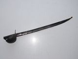 a small sword that is laying on a white surface