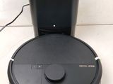 a black toilet with a black lid and a black lid