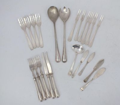 a lot of forks and spoons on the table
