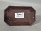 a brown tray that has a tag on it