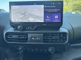 the dashboard of a car with a gps device mounted to it ' s dashboard