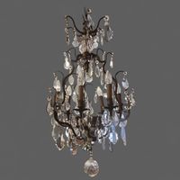 Lustre cage en bronze et laiton doré à pendeloques de verre.