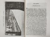 an open book with a drawing of a train on it