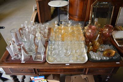 many glasses and trays on a table in a room