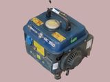 a small blue generator that is sitting on the ground