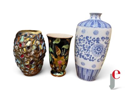 three vases sitting next to each other on a white surface