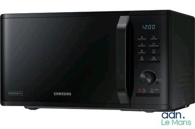 the samsung microwave is black and has a digital clock on the front