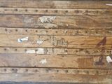 an old trunk that has been left on the floor