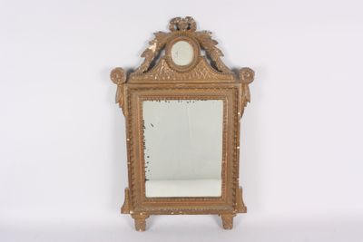 a gold mirror with a clock on the top of it