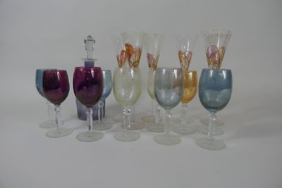 many different colored wine glasses sitting next to each other