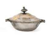 an antique silver plated casserole with a lid and handles