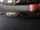an image of a close up of a silver plate on a chair