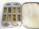 a pan with a sandwich inside of it on a table