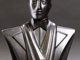 sculpture of a bust of a man in a tuxedo with a bow tie
