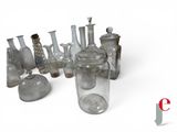 a lot of glass bottles that are sitting on a table