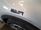 a close up of a car ' s bumper with a sticker on it