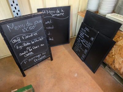 three chalk boards that are sitting on the floor next to each other