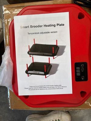 une boîte surmontée d'une plaque chauffante rouge